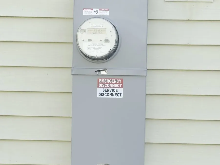 New electrical meter and service disconnect installed on a home